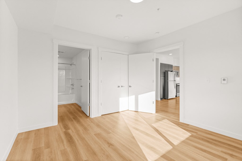 A room with wooden floors and white walls at Two 10 by Vintage, Shoreline, 98133