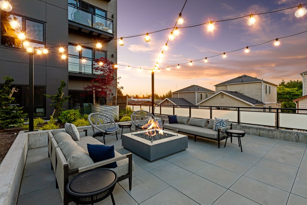 A patio with a fire pit and seating area  at Two 10 by Vintage, Shoreline