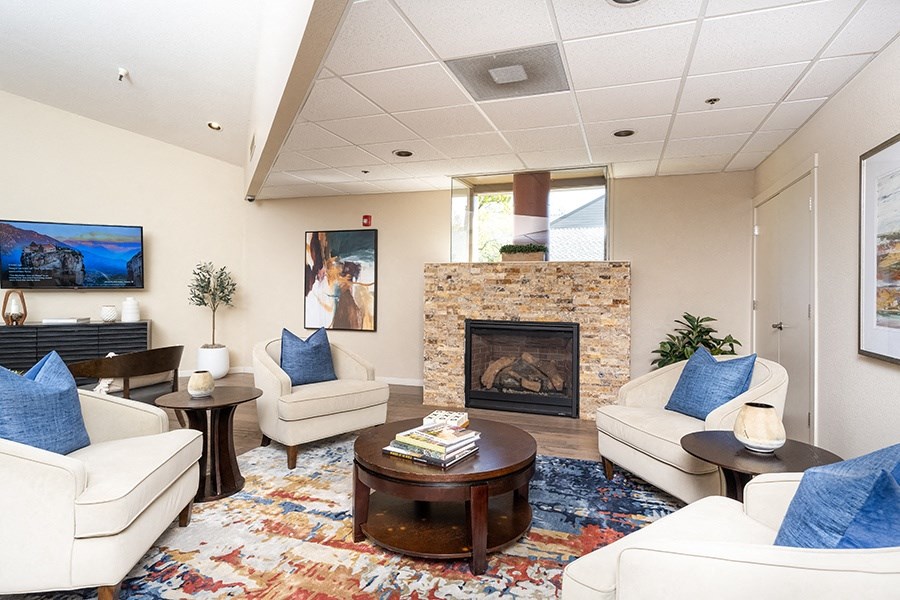 Clubhouse room with a fireplace and couches