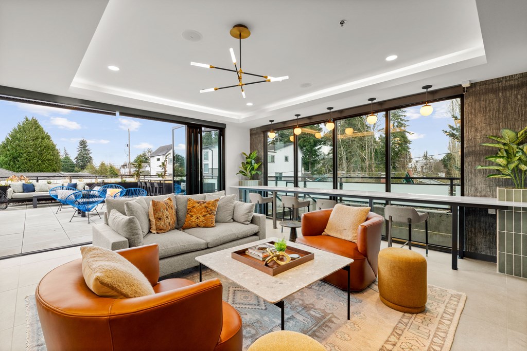 A modern living room with a large window and a view of the outdoors at Two 10 by Vintage, Shoreline, 98133
