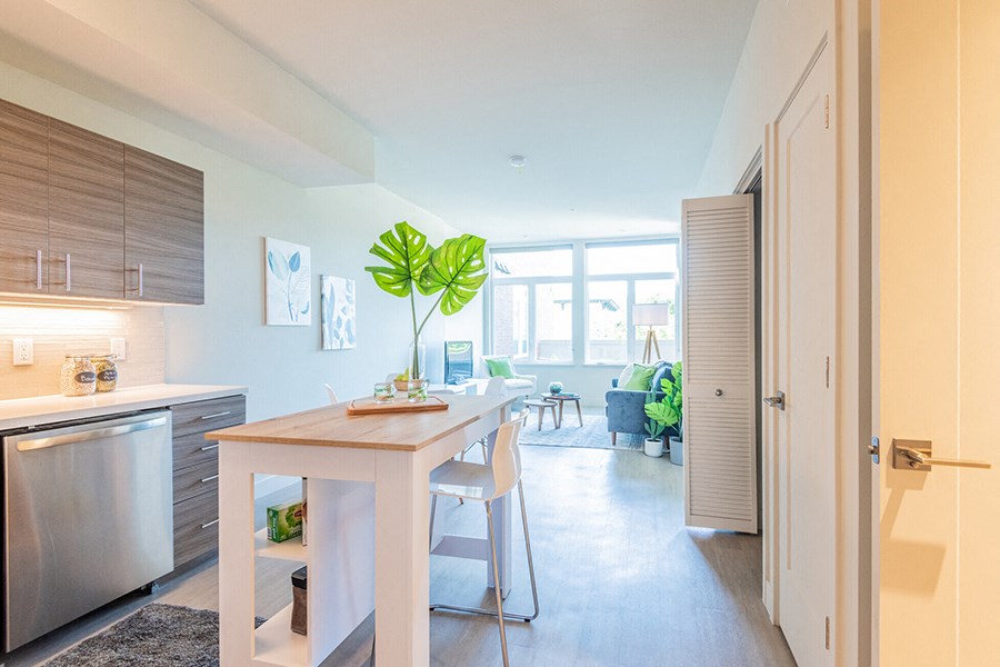 View of kitchen and living area and private balcony