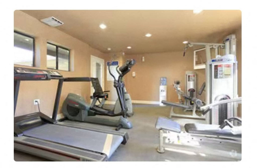 a room filled with lots of exercise equipment