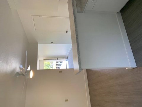 A white ceiling with a light fixture and a window.at OTAVON APARTMENTS, Novato, CA 94947