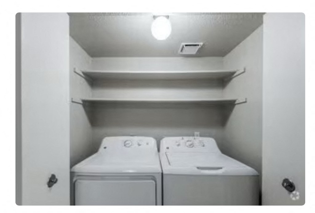 a white washer and dryer in a room