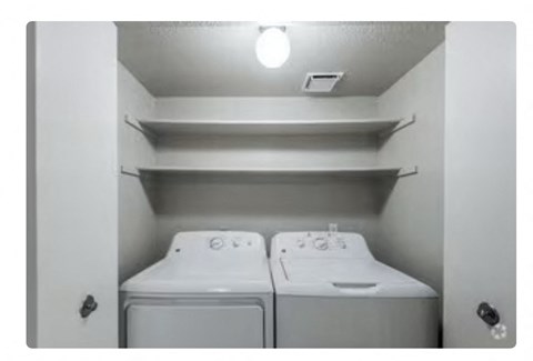 a white washer and dryer in a room