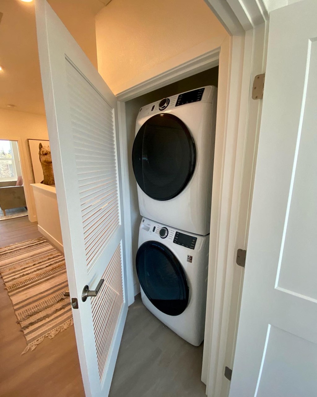 a front loading washer and dryer in a laundry closet