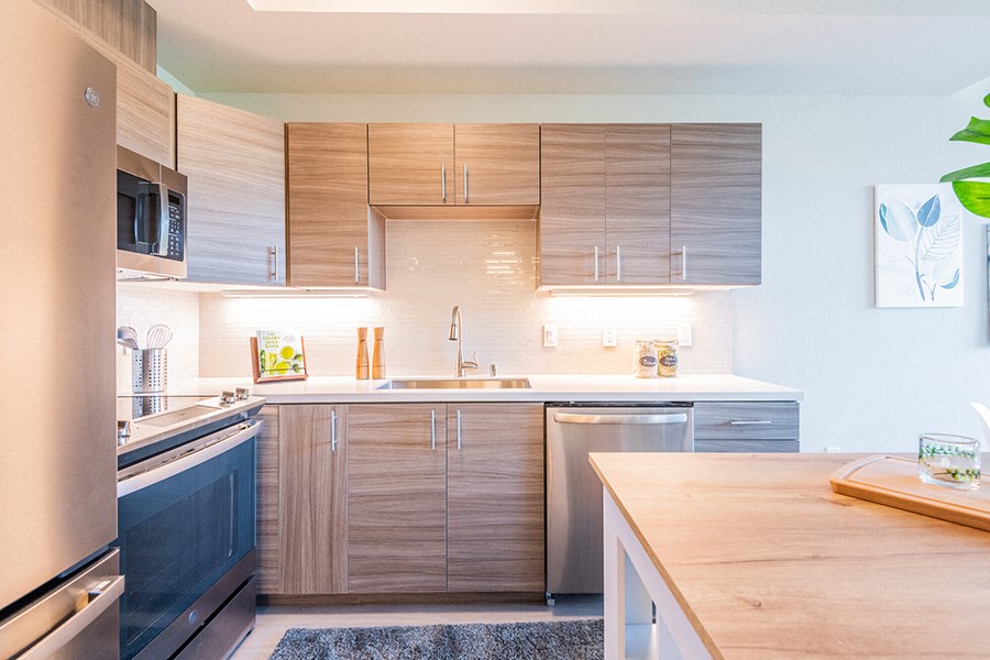 Kitchen area with full size stainless steel appliances