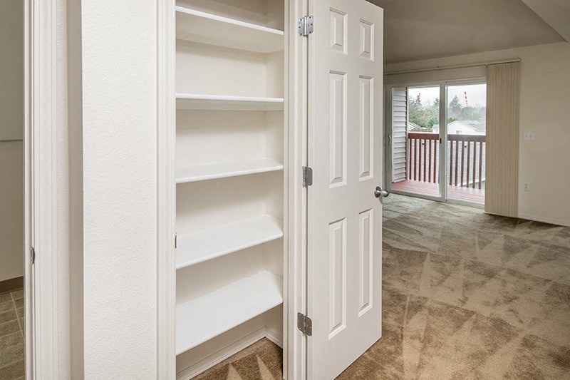Closet with shelves at THE VILLAGE Apartments, KEIZER, Oregon