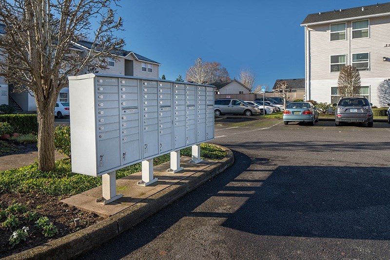 Exterior view of buildings and mail area at THE VILLAGE Apartments, KEIZER, OR