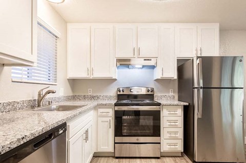 Wood floors in kitchen with stainless steel appliances
