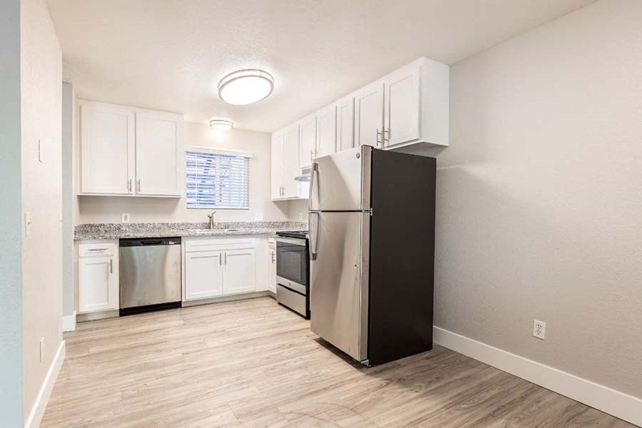 Wood floors in kitchen with stainless steel appliances