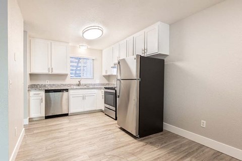 Wood floors in kitchen with stainless steel appliances