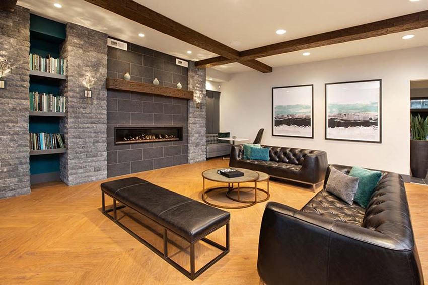 Clubhouse seating by fireplace l Alira Apartments in Sacramento Ca