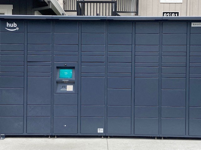 a row of blue lockers with a blue screen on the door