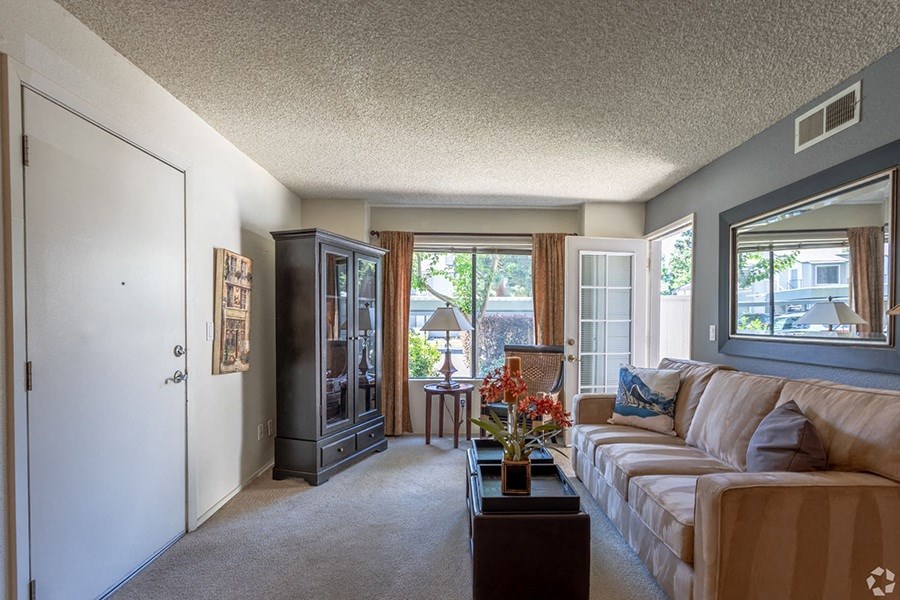 Ashford Park living room with carpeting and view of patio space and sliding door