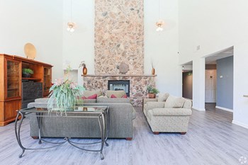 Ashford Park resident lounge area with fireplace and couches - Photo Gallery 2