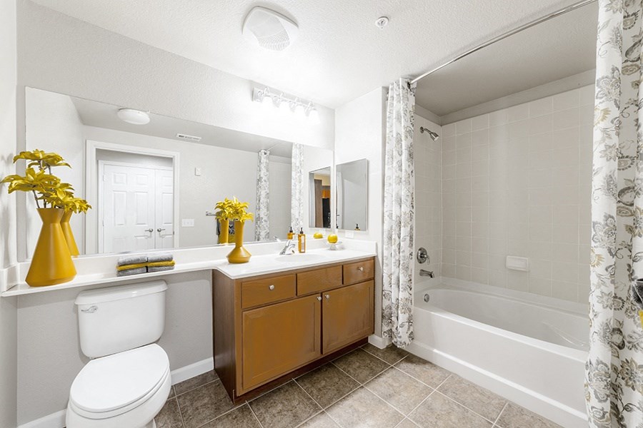 a bathroom with a toilet and a tub