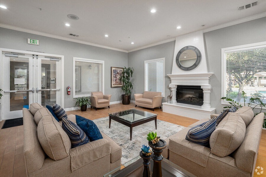 a living room with a couch and a fireplace