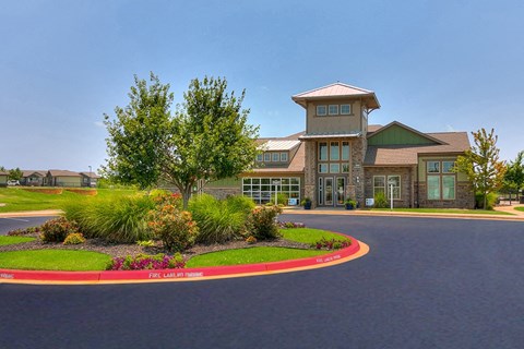 Driveway to enter community with landscape