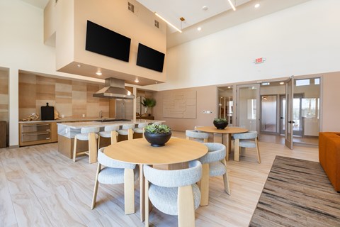 A modern dining area with a round table and chairs.