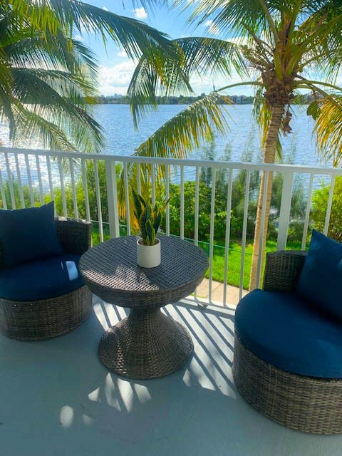 Chairs on a patio at  Aqua 2800 Apartments in Oakland Park Florida