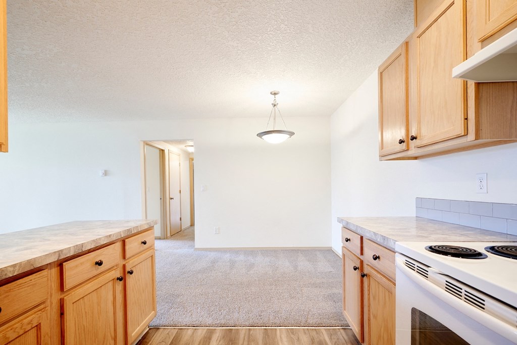 Dining area with overhead lighting at Devonwood and First Place Apartments, Battle Ground