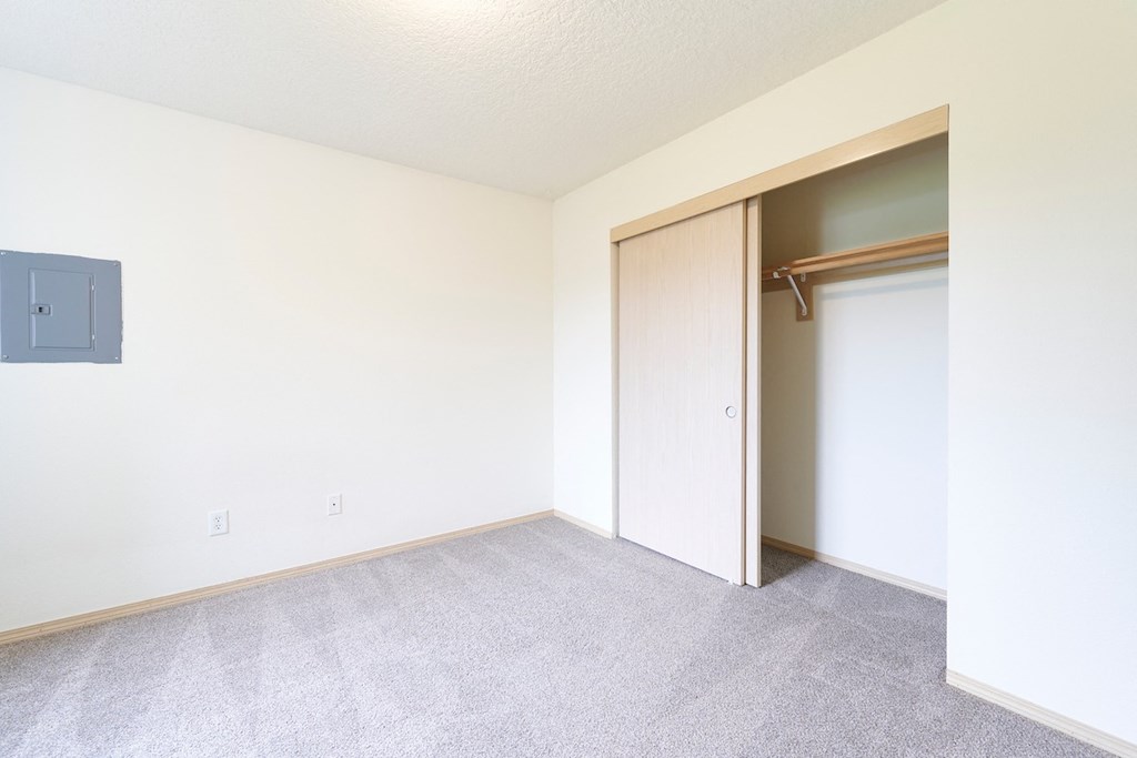 Bedroom with large closet at Devonwood and First Place Apartments, Battle Ground, WA 98604