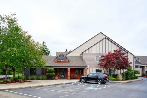  leasing office entrance with parking at Devonwood and First Place Apartments, Battle Ground, WA
