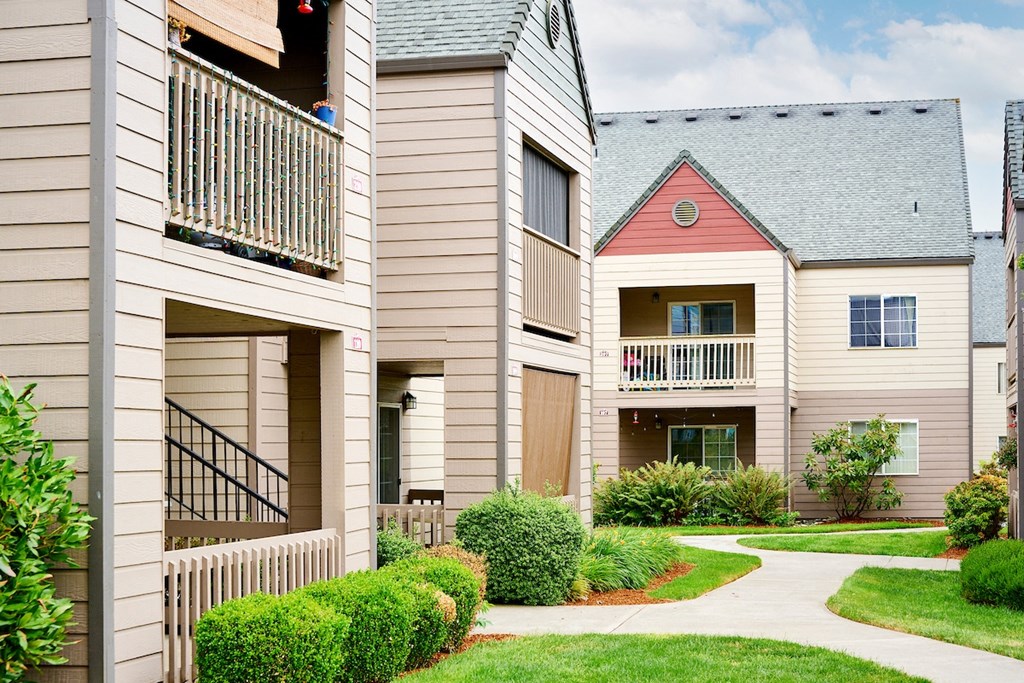 Building exteriors and lush landscaping at Devonwood and First Place Apartments, Washington