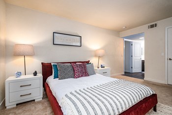 Apartment Vacaville CA - Camden Parc - Furnished Bedroom With a Cozy Bed, Two Bedside Tables, and Two Lamps - Photo Gallery 5