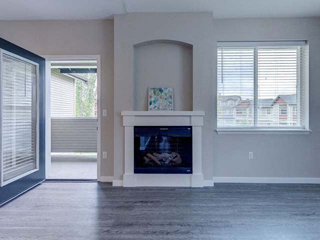 Apartments for Rent in Fife-Bella Sonoma Apartments Spacious Living Room With Large Windows And Fireplace With Mantle