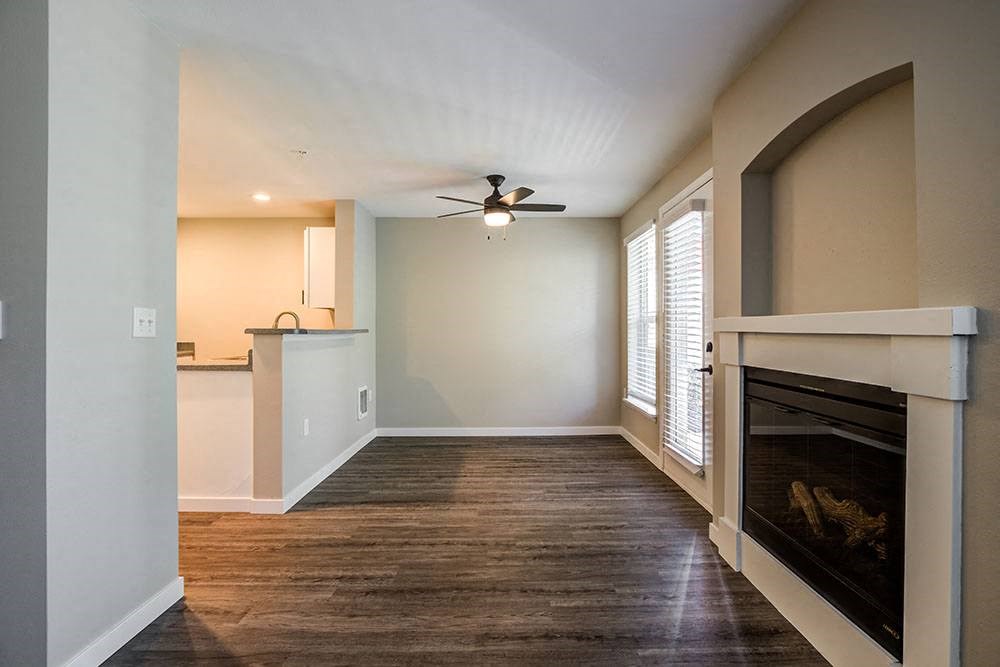 Living Room with Wood-Style Flooring, Grey Walls, and Fireplace at BELLA SONOMA, Fife, 98424