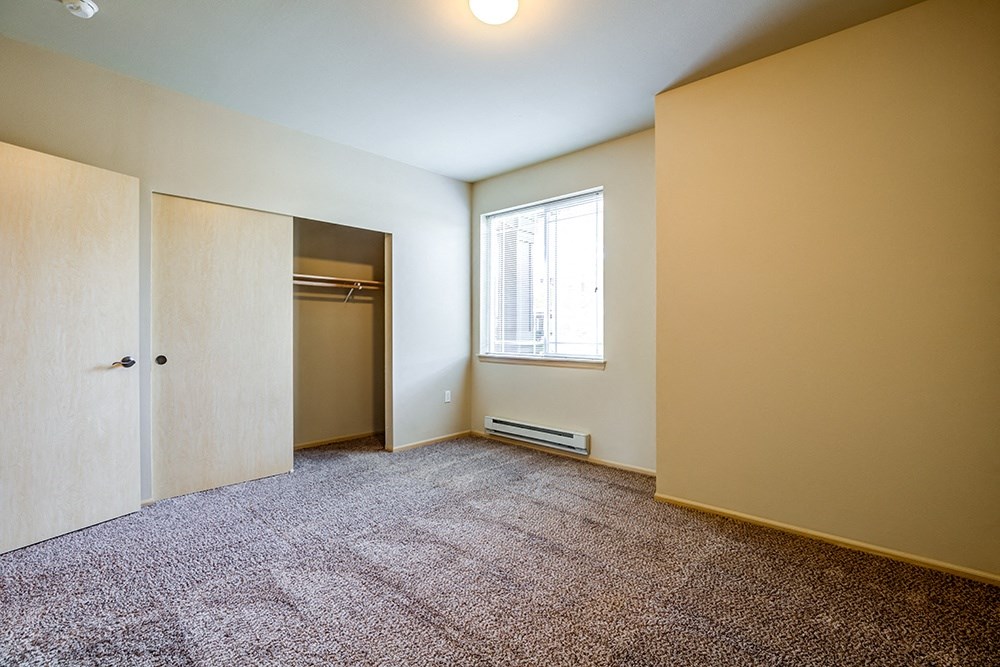 Bedroom with carpet and window at BELLA SONOMA, Fife, WA