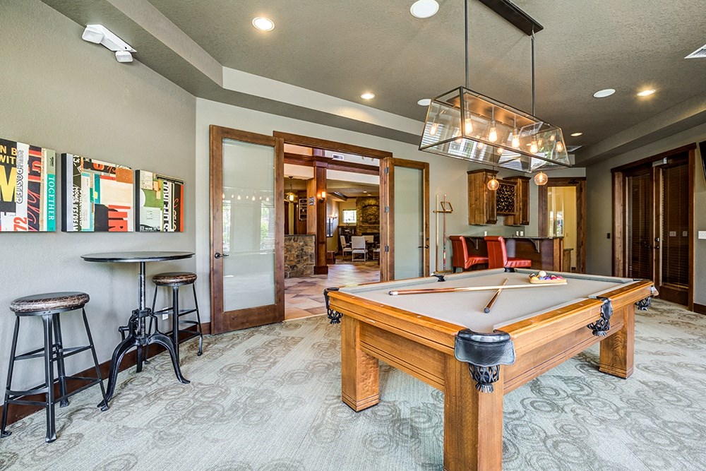 Billiards Room with Billiard Table, Hanging Light, and Stylish, Modern Decor, Surrounded by Seating at BELLA SONOMA, Fife, WA 98424