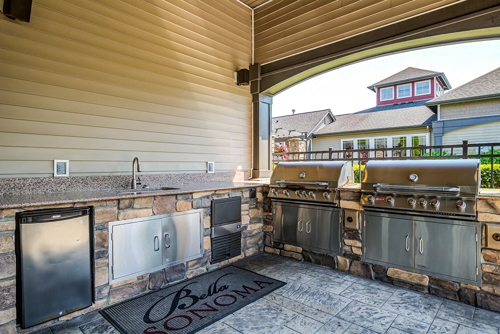 BBQ Area with Two Grills, Sink, Mini-Fridge, and Countertop at BELLA SONOMA, Washington, 98424