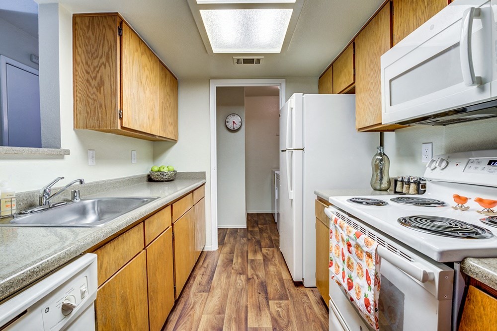 Kitchen with appliance and view to hall