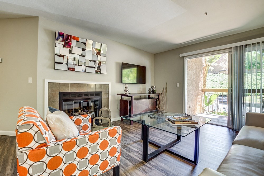 Living Room with fireplace and patio