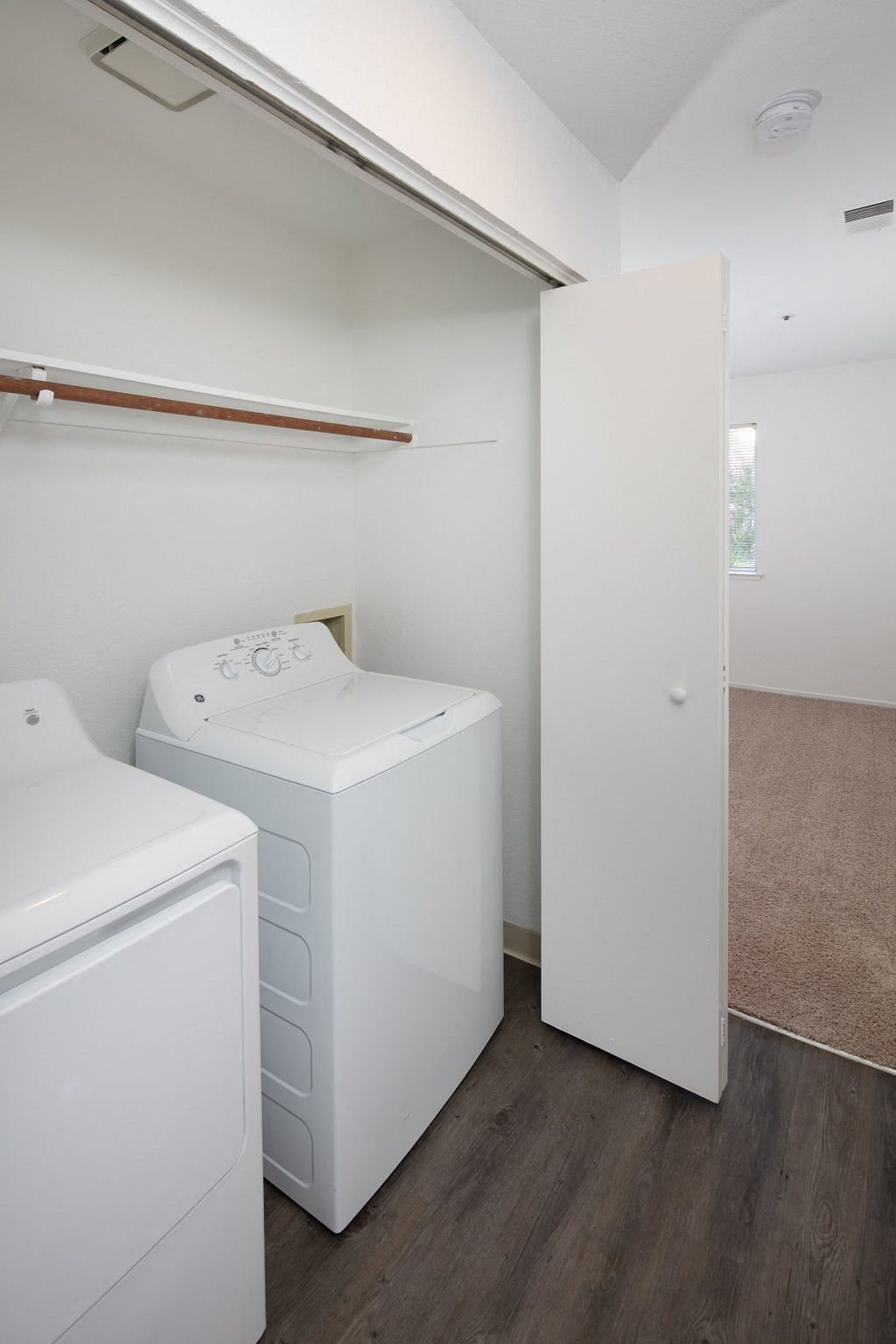 Full Sized In Unit Washer and Dryer With a Closet, Folding Doors, and Shelves for Extra Storage at Laurel Creek, California, 94533