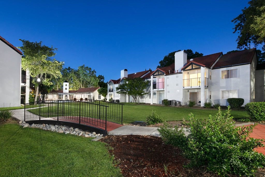 Courtyard with Connecting Bridge, Manicured Grass, and View of Apartments Complex at Laurel Creek, Fairfield, CA