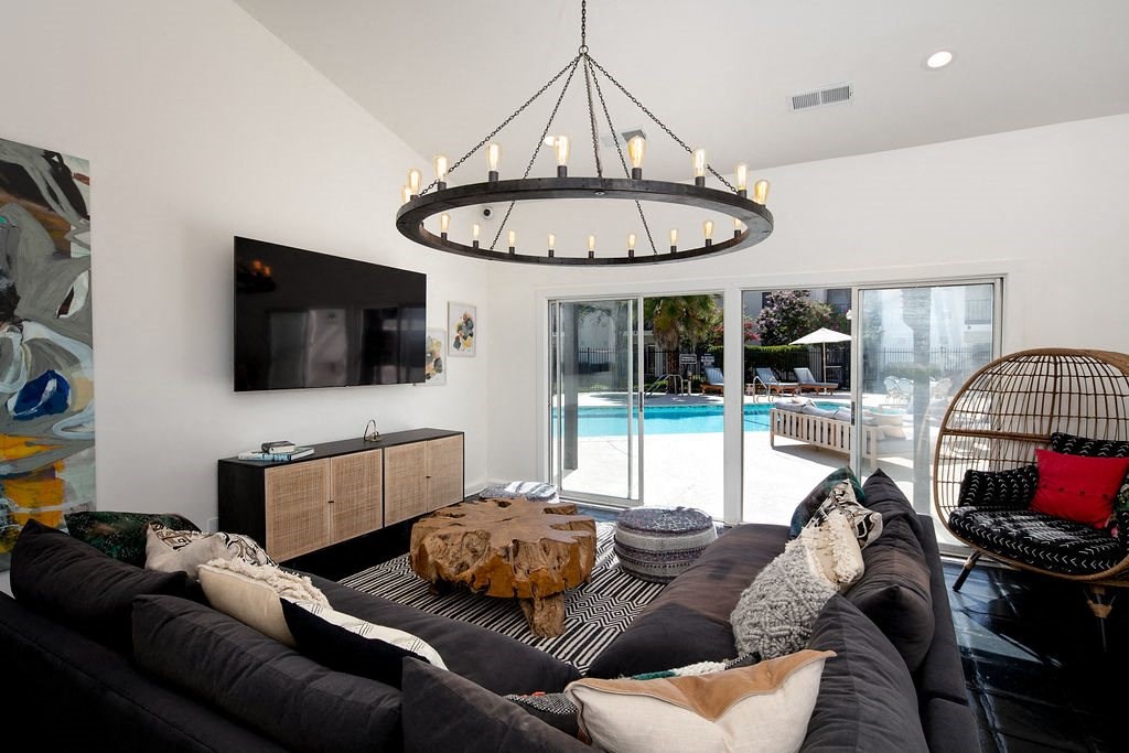 Clubhouse with Grey Sectional Couch, Modern Hanging Chandelier, and Pool Access at Laurel Creek, Fairfield, California