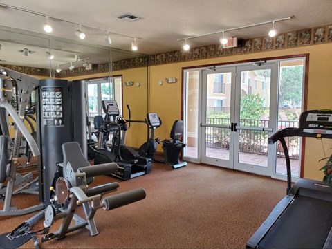 Gym with cardio equipment at Bernwood Trace Apartments, Fort Myers, FL