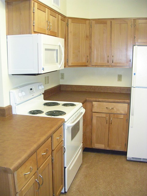 Kitchen With Cabinets at Bridge Meadows North Portland 55+, Portland