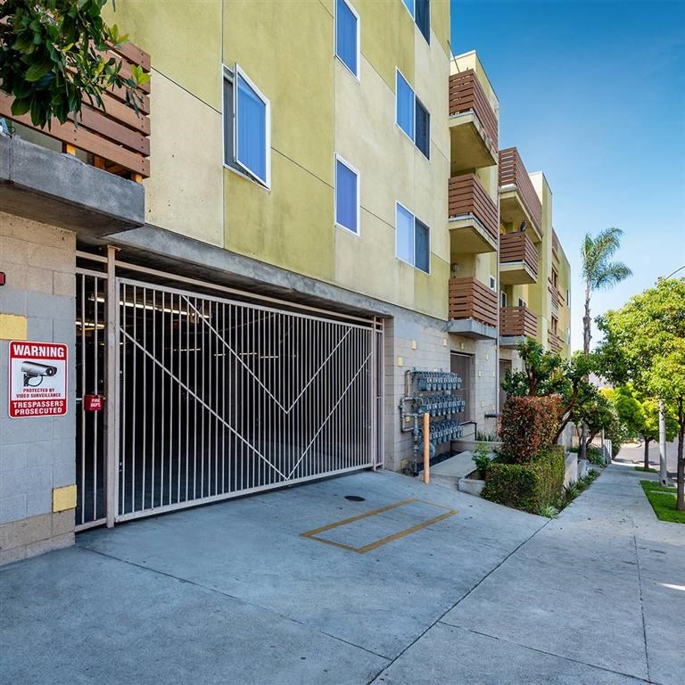 Exterior of building near sidewalk and gater