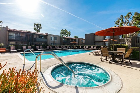 our apartments have a resort style pool with chairs and umbrellas at CASA GRANDE APARTMENT HOMES, Cypress, 90630