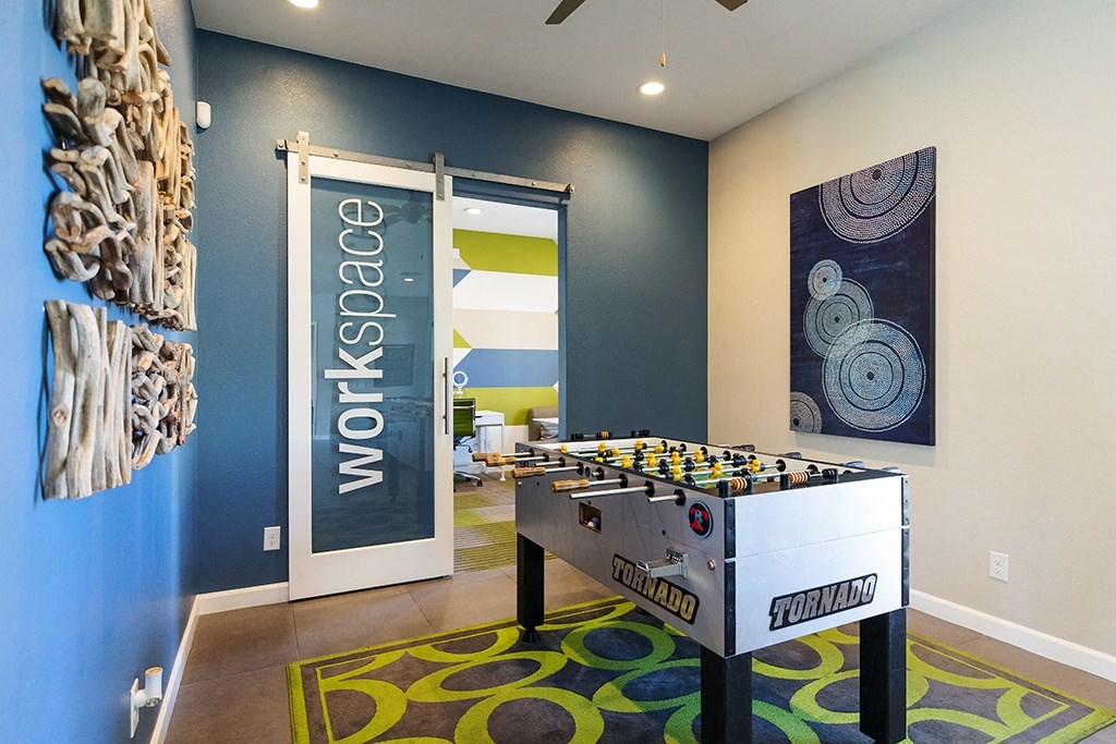 Lounge area with games at CHANDLER APARTMENT HOMES, Las Vegas, 89139