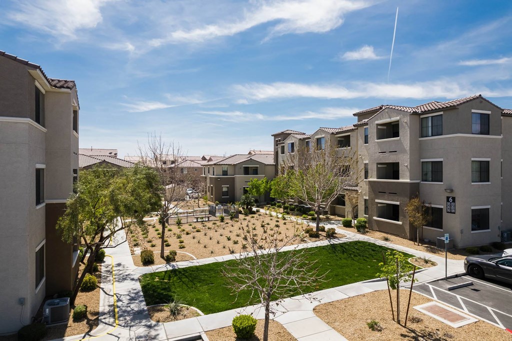 an aerial view of an apartment complex with a green courtyard at CHANDLER APARTMENT HOMES, Las Vegas