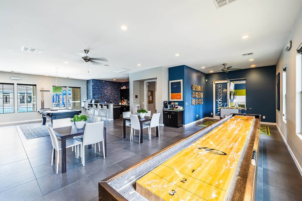 a game room with a pool table and a bar at CHANDLER APARTMENT HOMES, Las Vegas, NV, 89139