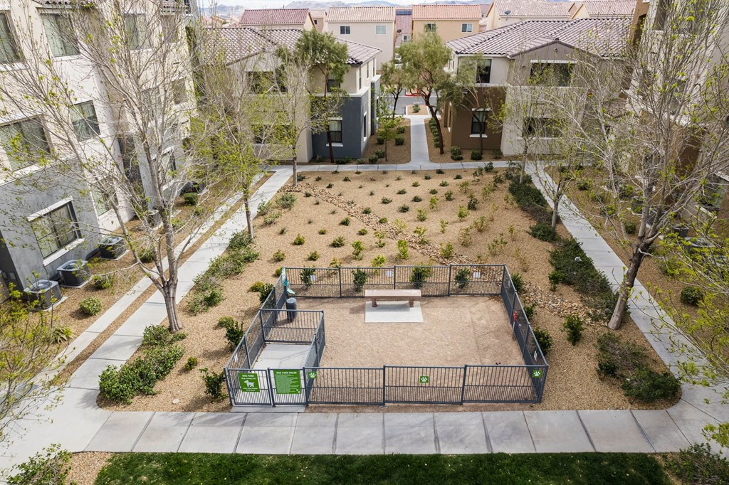 an aerial view of a courtyard with benches and trees at CHANDLER APARTMENT HOMES, Las Vegas, NV