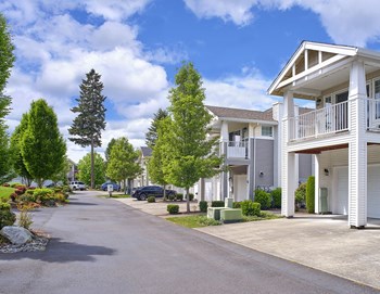 Clock Tower Village community exterior with parking and balconies - Photo Gallery 38
