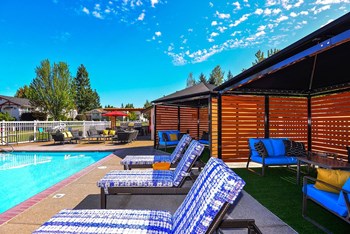 Clock Tower Village pool with lounge chairs - Photo Gallery 24